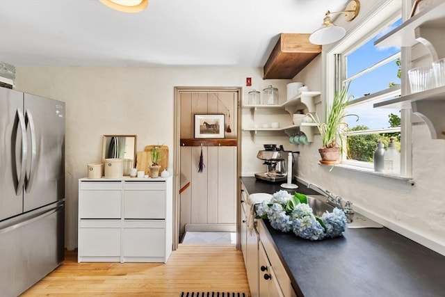 6 Manomet Rd, Woburn, MA 01801 - kitchen with freestanding refrigerator, plenty of natural light, dark countertops, and open shelves