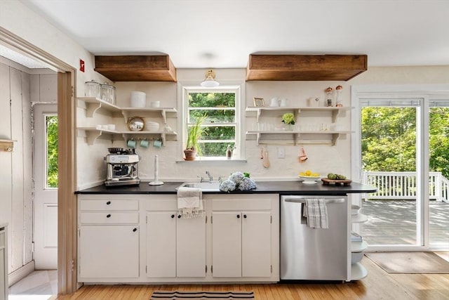 6 Manomet Rd, Woburn, MA 01801 - kitchen with dishwasher, open shelves, dark countertops, backsplash, and light wood finished floors