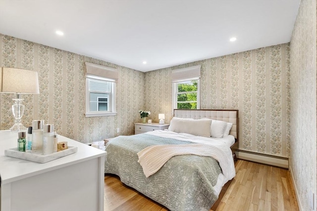 6 Manomet Rd, Woburn, MA 01801 - bedroom with a baseboard radiator, light wood-style flooring, recessed lighting, and wallpapered walls