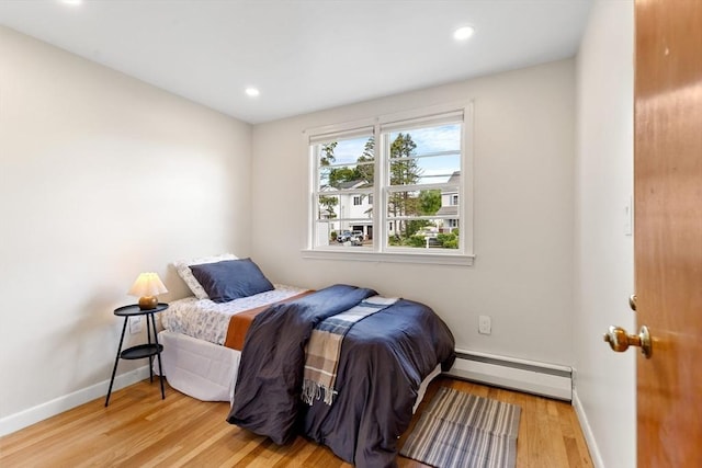 6 Manomet Rd, Woburn, MA 01801 - bedroom featuring a baseboard radiator, light wood-style floors, baseboards, and recessed lighting