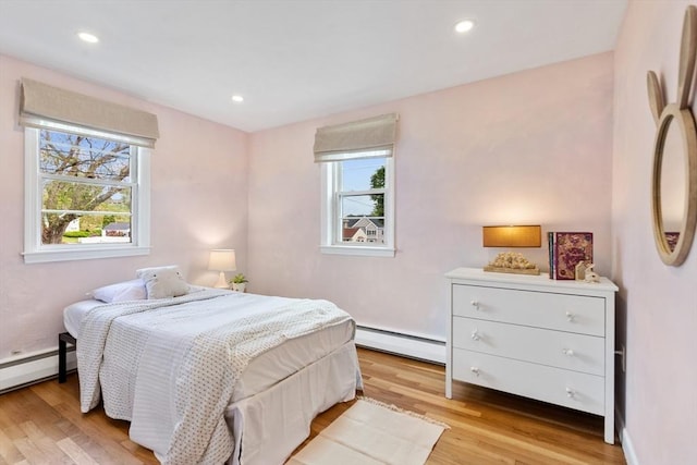 6 Manomet Rd, Woburn, MA 01801 - bedroom featuring a baseboard radiator, light wood-type flooring, baseboard heating, recessed lighting, and baseboards