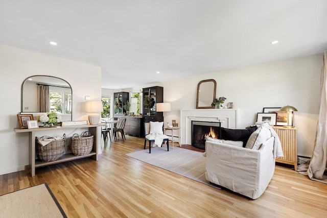 6 Manomet Rd, Woburn, MA 01801 - living room with light wood-style floors, a fireplace with flush hearth, and recessed lighting