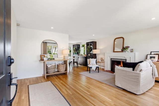 6 Manomet Rd, Woburn, MA 01801 - living area with a lit fireplace, wood finished floors, and recessed lighting