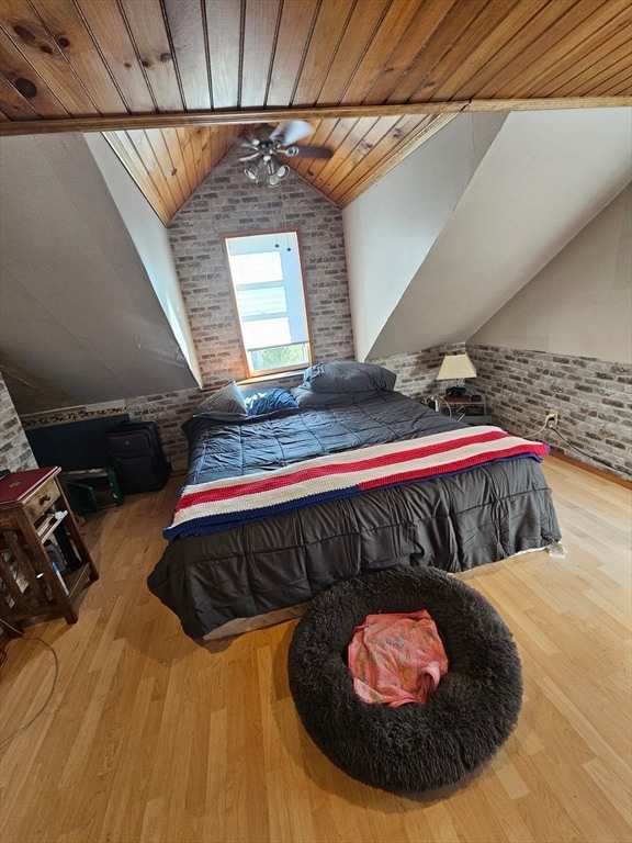 bedroom with light hardwood / wood-style flooring, brick wall, wood ceiling, and vaulted ceiling