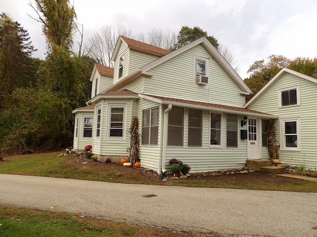 view of side of home featuring cooling unit