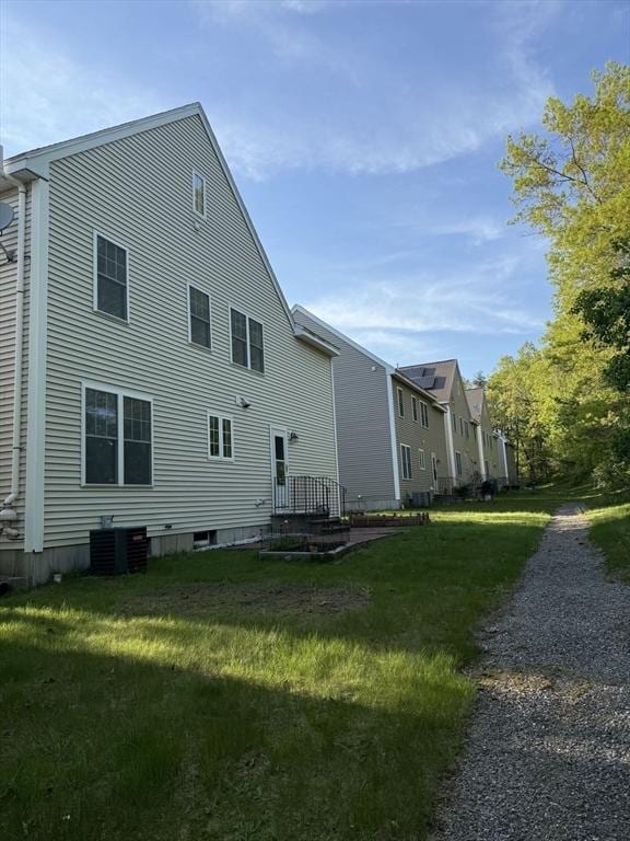 5 Samantha Way Unit 5, Acton, MA 01720 - rear view of house with central air condition unit and a lawn