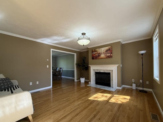 5 Samantha Way Unit 5, Acton, MA 01720 - living room with light wood-style floors, baseboards, a high end fireplace, and ornamental molding
