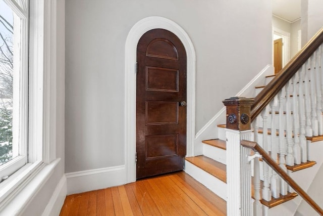 foyer entrance with light hardwood / wood-style floors