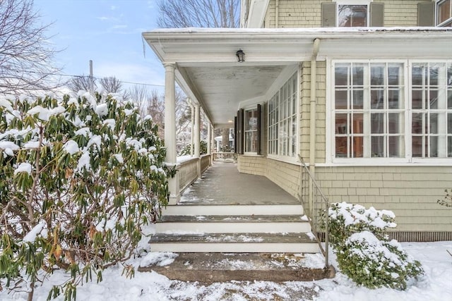 view of snow covered property entrance