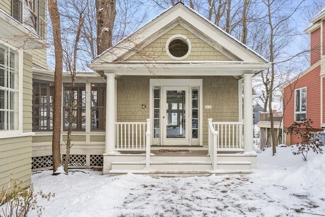 view of snow covered property entrance