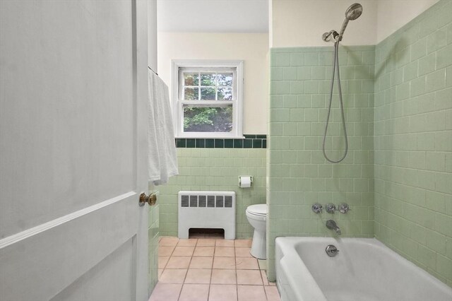 23 Ivan St, Lexington, MA 02420 - full bathroom with radiator, tile patterned flooring, washtub / shower combination, tile walls, and a wainscoted wall
