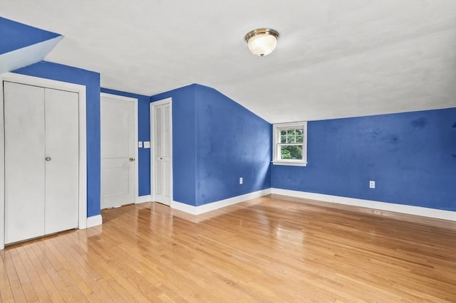 23 Ivan St, Lexington, MA 02420 - additional living space featuring lofted ceiling and wood finished floors