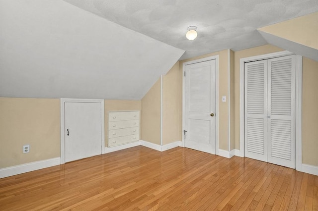 23 Ivan St, Lexington, MA 02420 - additional living space with light wood-style flooring and lofted ceiling