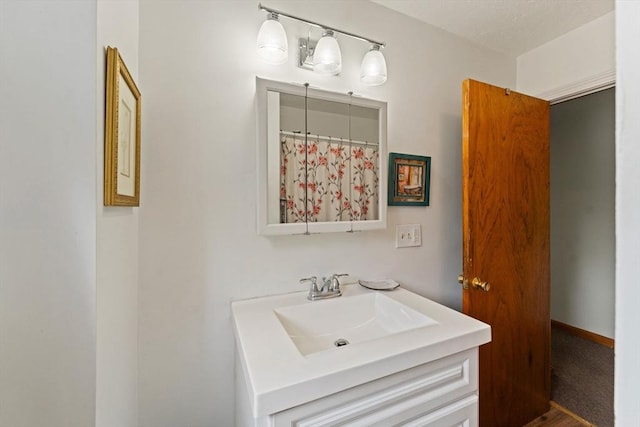 full bathroom with vanity and curtained shower