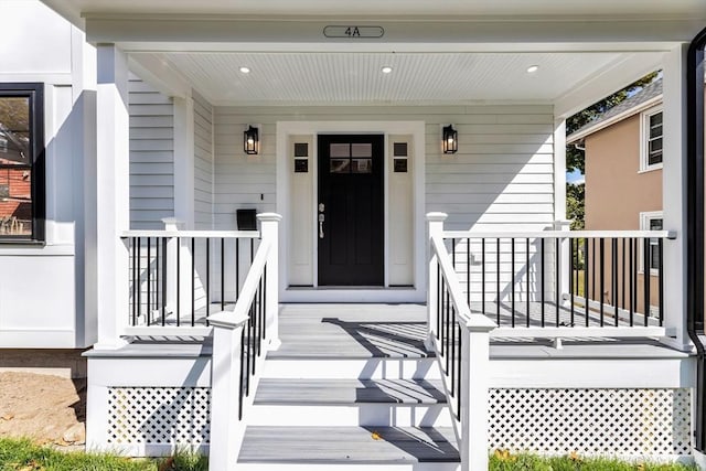 property entrance with covered porch