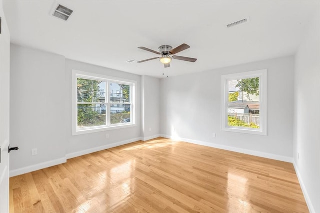 spare room featuring ceiling fan and light wood-type flooring