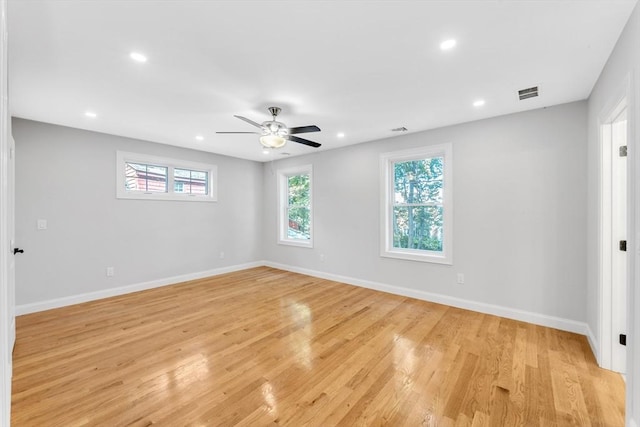 empty room featuring ceiling fan and light hardwood / wood-style floors