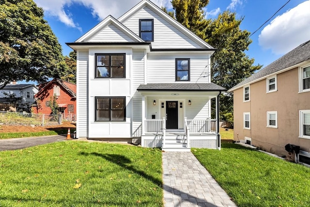 view of front facade with a porch and a front yard