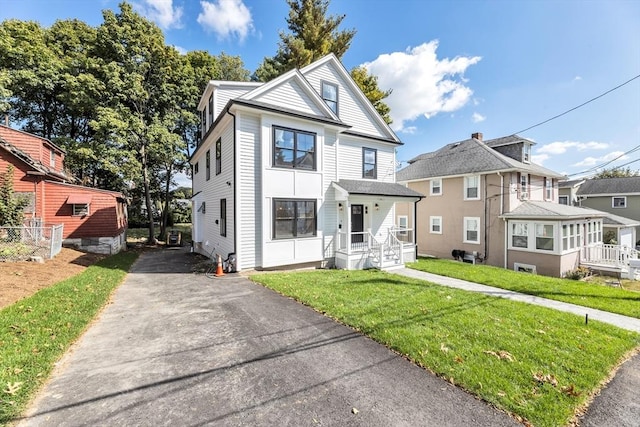 view of property featuring a front yard