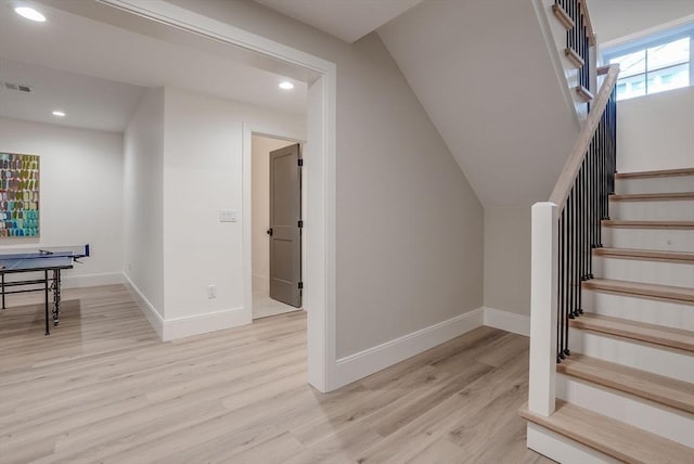 stairway featuring visible vents, baseboards, wood finished floors, and recessed lighting