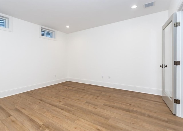 interior space featuring recessed lighting, baseboards, visible vents, and light wood finished floors