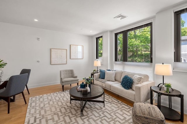 100 Linden St Unit 202, Wellesley, MA 02482 - living room with light wood-style floors and recessed lighting
