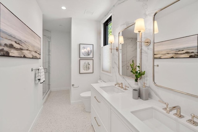 100 Linden St Unit 202, Wellesley, MA 02482 - full bath featuring a marble finish shower, double vanity, speckle patterned floor, and recessed lighting