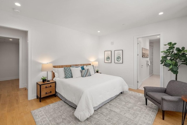 100 Linden St Unit 202, Wellesley, MA 02482 - bedroom with light wood finished floors and recessed lighting