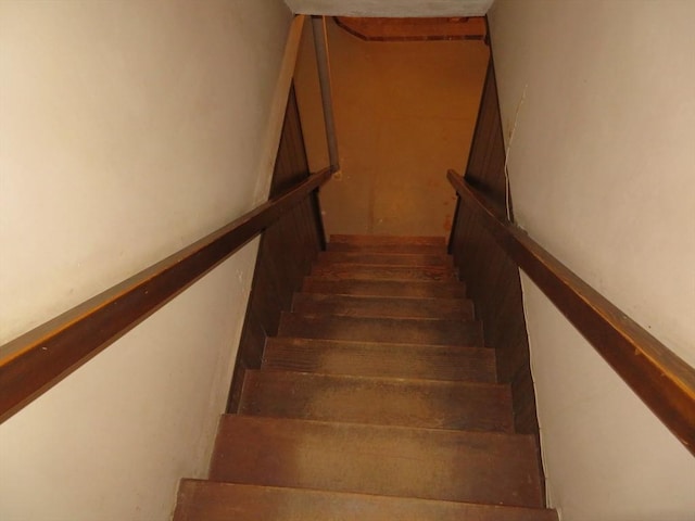 stairs with wood finished floors