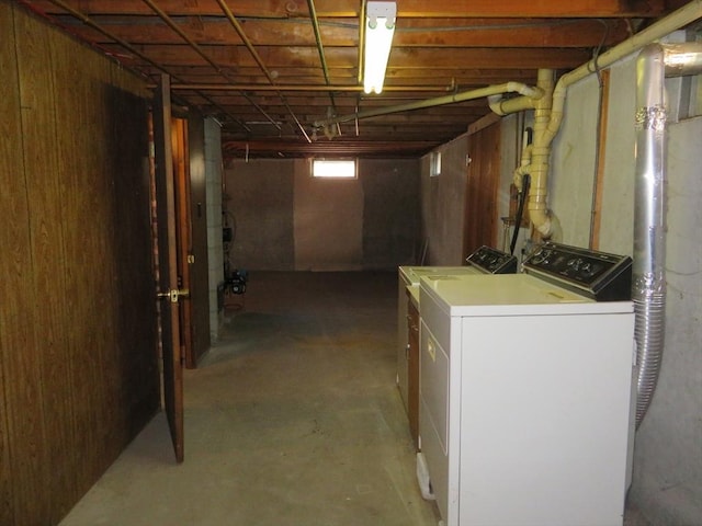 below grade area with washing machine and clothes dryer