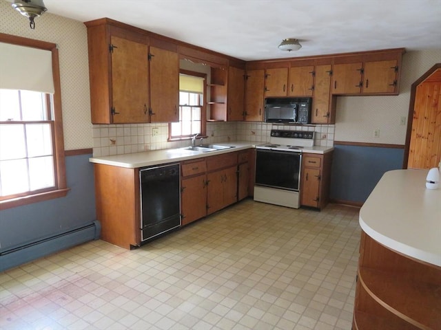 kitchen with open shelves, black appliances, light countertops, and wallpapered walls