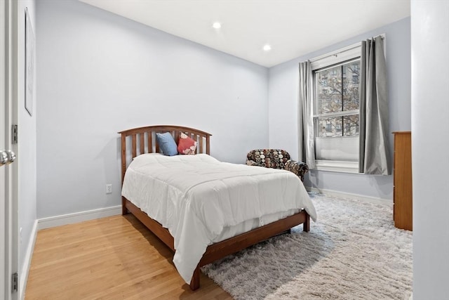 bedroom featuring recessed lighting, baseboards, and wood finished floors