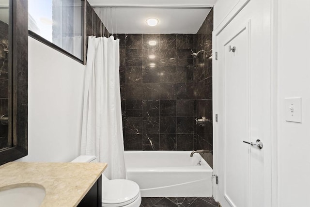 bathroom featuring marble finish floor, shower / tub combo with curtain, vanity, and toilet