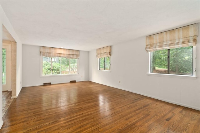 18 Juniper Ln, Framingham, MA 01701 - empty room with wood finished floors and baseboards