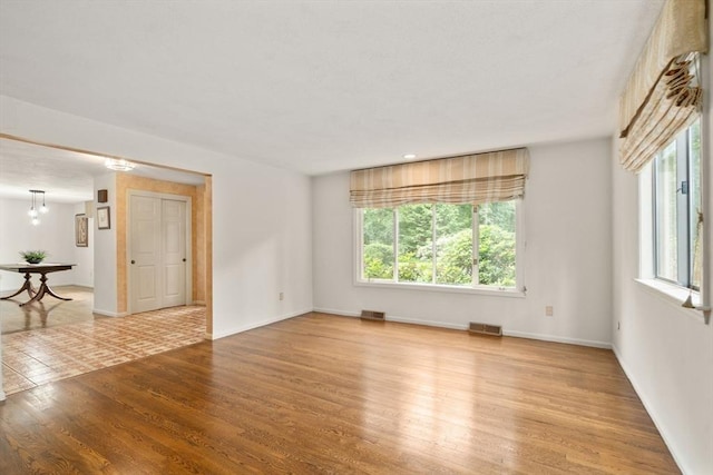 18 Juniper Ln, Framingham, MA 01701 - empty room with light wood-style floors and baseboards