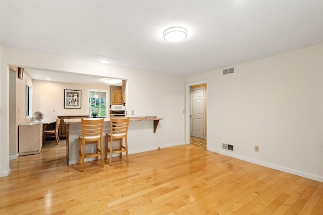 18 Juniper Ln, Framingham, MA 01701 - dining room with light wood finished floors and baseboards
