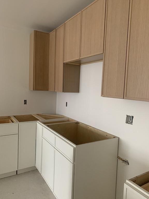 kitchen featuring finished concrete flooring