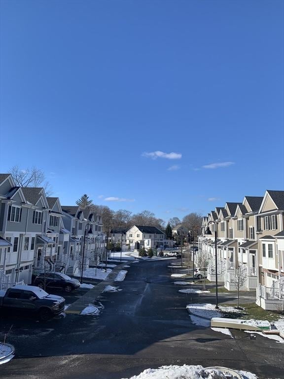 view of road featuring curbs and a residential view