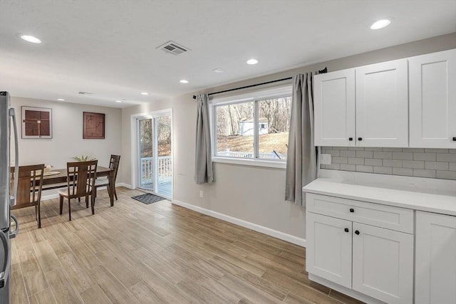 dining space with light wood-type flooring