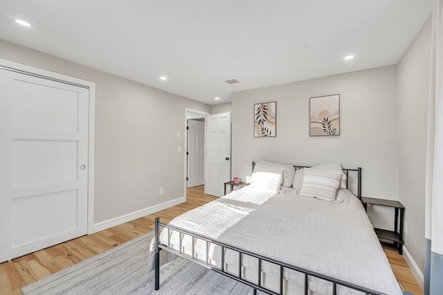 bedroom with light hardwood / wood-style floors