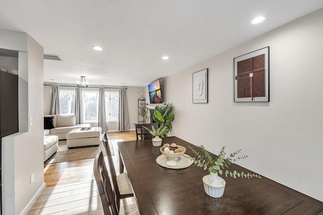 dining area with light hardwood / wood-style floors