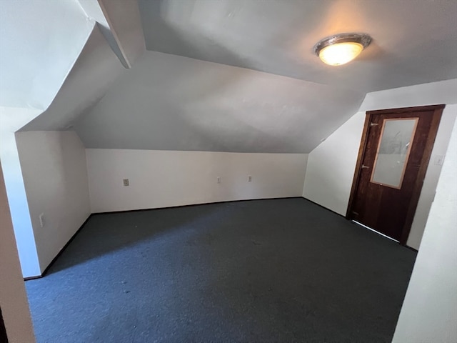 bonus room featuring carpet and lofted ceiling