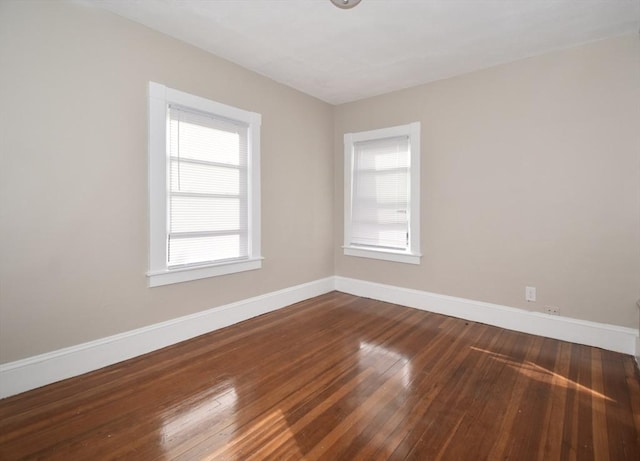 empty room featuring wood-type flooring