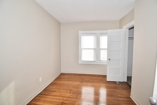 unfurnished bedroom featuring wood-type flooring