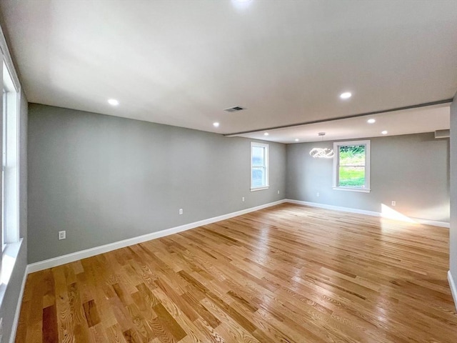 spare room with visible vents, recessed lighting, baseboards, and light wood finished floors