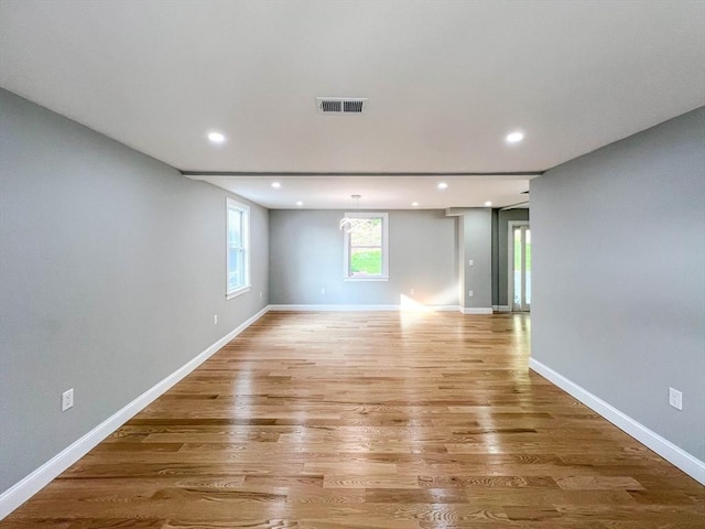 empty room featuring recessed lighting, visible vents, baseboards, and light wood-style flooring