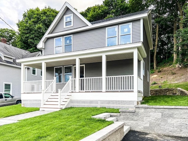 view of front of home featuring a porch and a front lawn