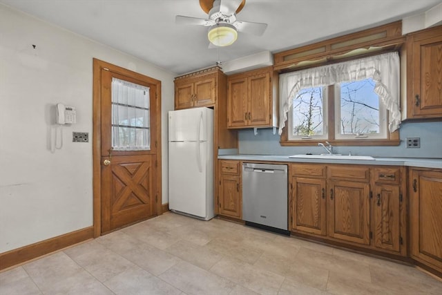 kitchen with ceiling fan, dishwasher, sink, and white fridge