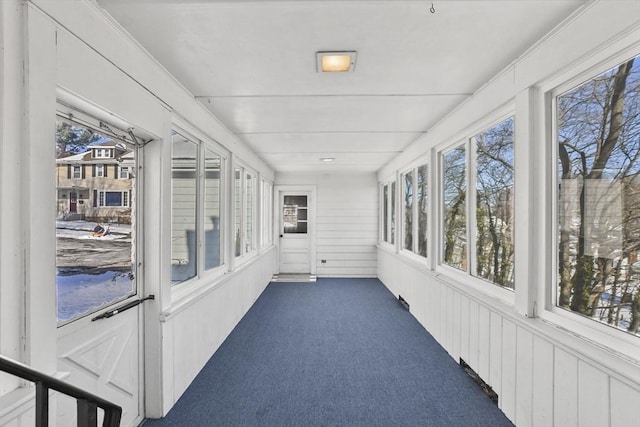 unfurnished sunroom with plenty of natural light