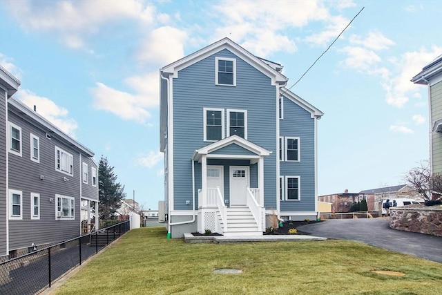 view of property featuring a front yard